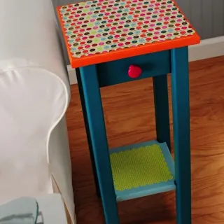 Colorful end table makeover with paint, scrapbook paper, and Mod Podge
