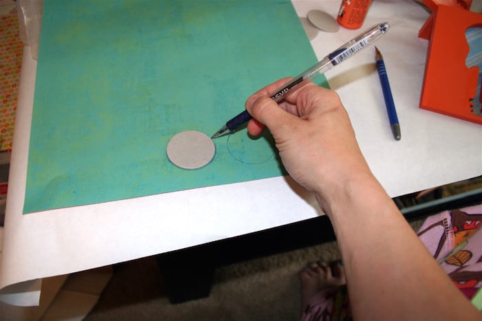 Trace chipboard circles on scrapbook paper