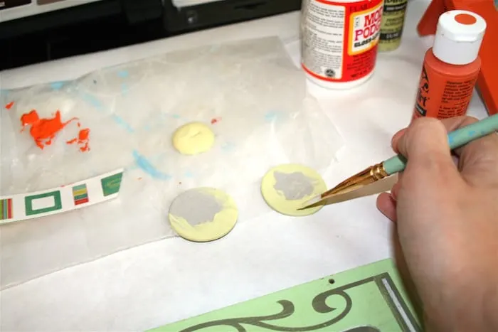 Paint chipboard circles with lime paint