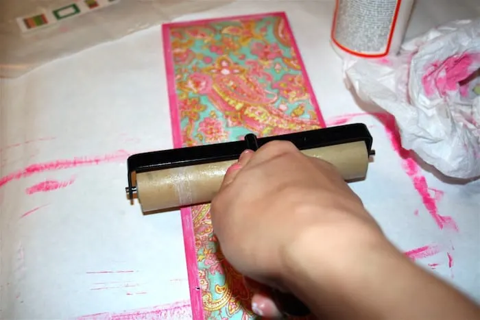 Roll the paper down with a brayer