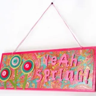 Make this fun spring craft: a Mod Podge sign using dollar store materials! Pick your favorite colors and scrapbook papers to personalize.
