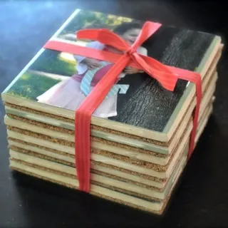 DIY photo coasters stacked and tied with a ribbon