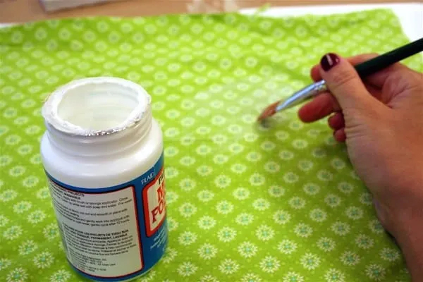 Painting green fabric with Mod Podge