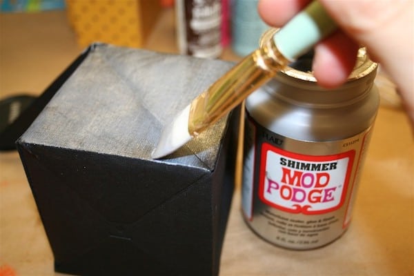 Painting a black paper cube with silver shimmer Mod Podge