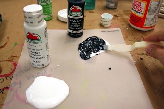 Mixing black acrylic paint and Mod Podge