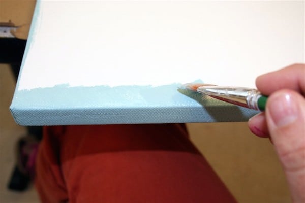 Paint the edges of a square canvas with blue acrylic paint
