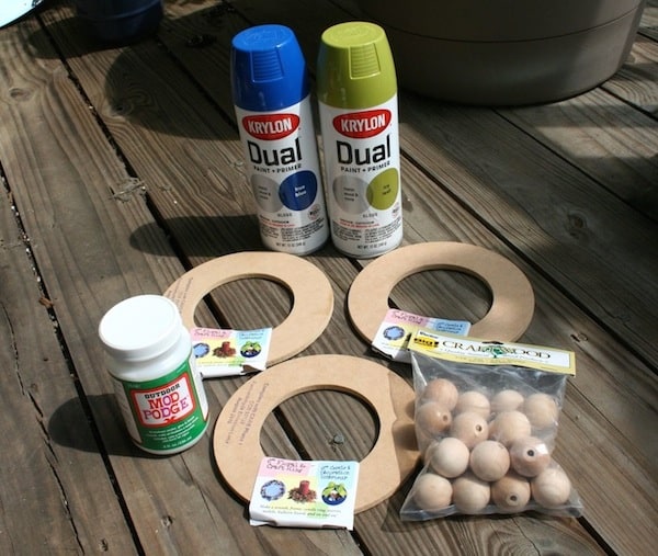 Spray paint, Wood circles, Wood balls, and Outdoor Mod Podge