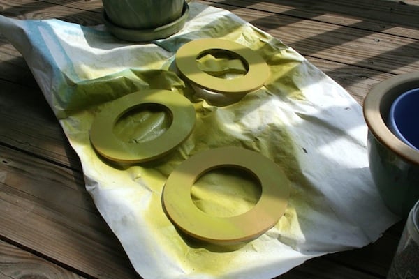 Wood circles spray painted with green paint