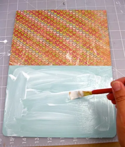 Adding Mod Podge to the clipboard with a paintbrush