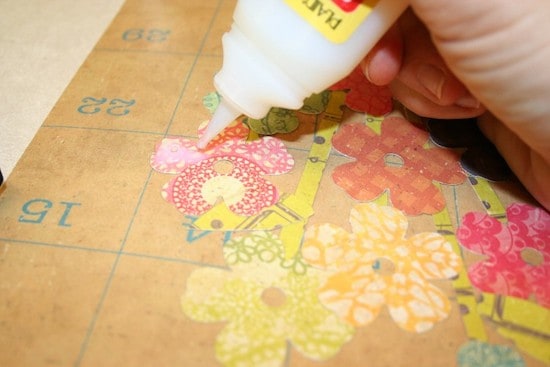 Applying Dimensional Magic to the flowers cut out of scrapbook paper
