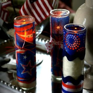 Make firecracker candles for Fourth of July using dollar store votives, napkins, and Mod Podge. These are so easy and look great for the holiday!