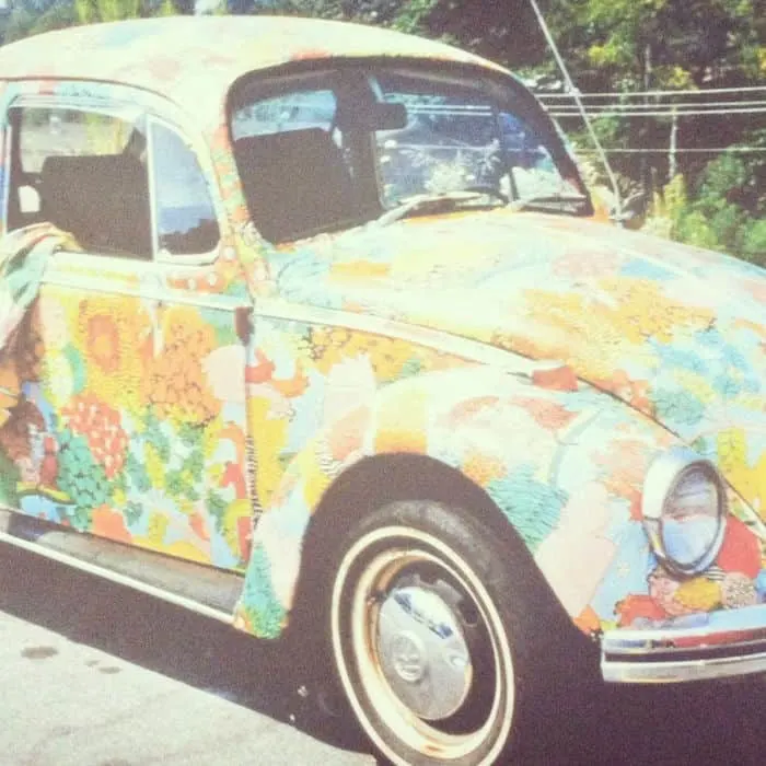 Volkswagen Beetle decoupaged with vintage sheets using Mod Podge