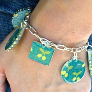Are you looking for a fun jewelry craft or a unique gift idea? This DIY charm bracelet is made with cute fabric and Dimensional Magic!