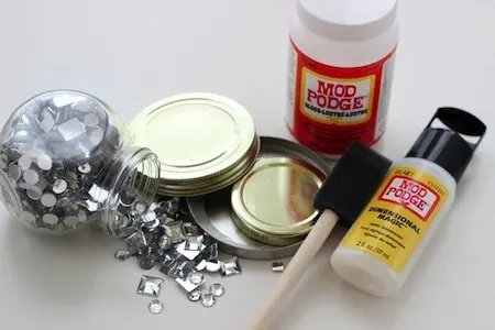 Supplies to make can lid ornaments