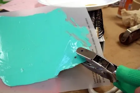 Using a hole punch on window cling material