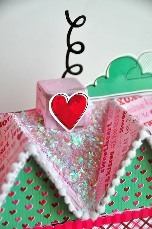 Add some love to your holiday decor with this DIY Valentine's Day paper mache house! Alter with all sorts of pretty embellishments.