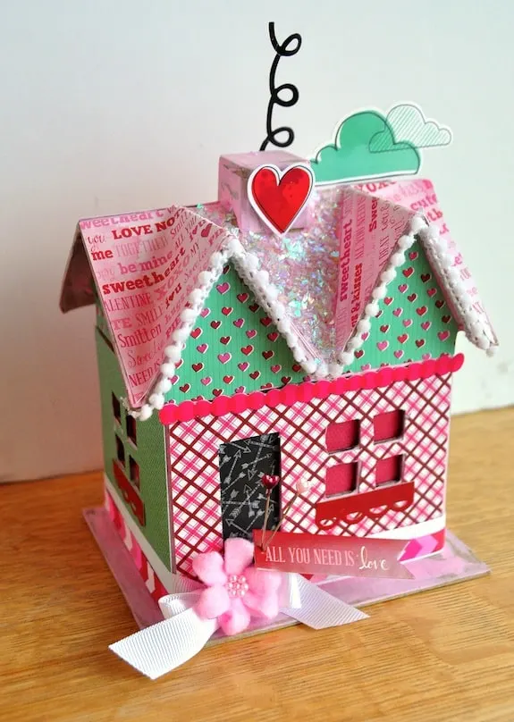 Add some love to your holiday decor with this DIY Valentine's Day paper mache house! Alter with all sorts of pretty embellishments.
