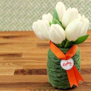 This St. Patrick's Day vase is the easiest thing you'll ever do! Bring a little luck into your home with Mod Podge and green yarn.