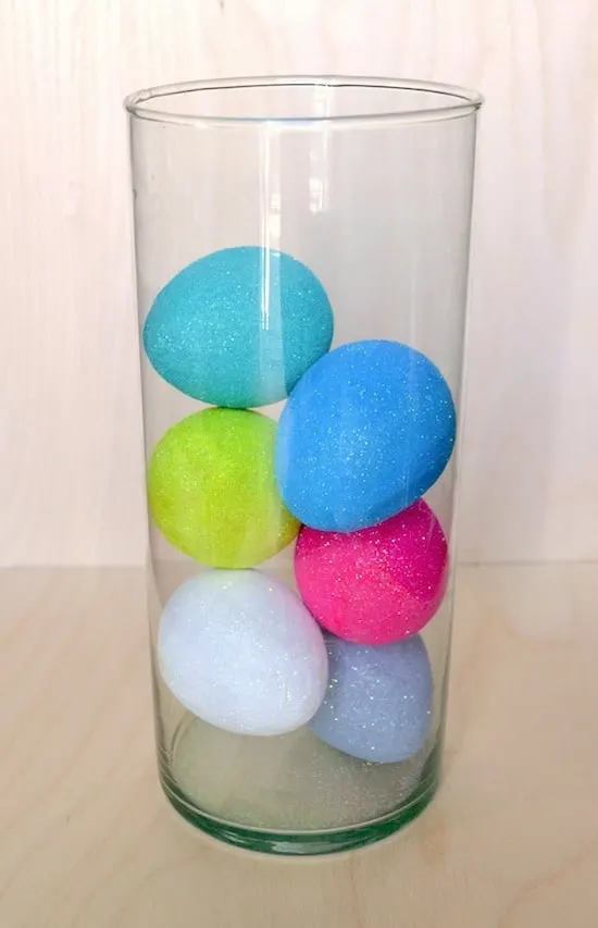 Large glass vase with glitter eggs inside