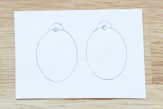 Earring shapes traced onto paper