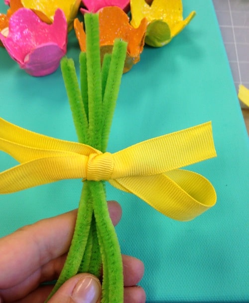 Pipe cleaners tied together with yellow ribbon