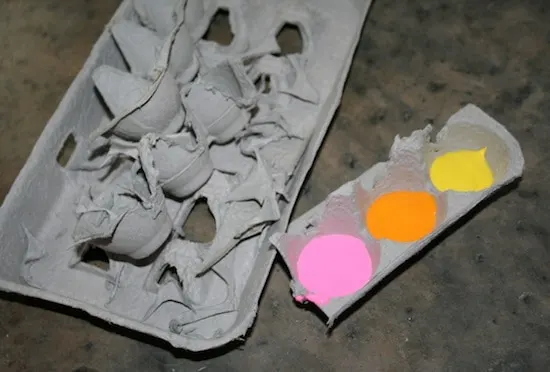 egg carton with pink, orange, and yellow paint