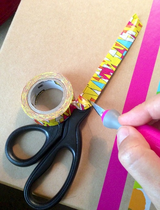 Washi tape applied to the blades on a pair of scissors