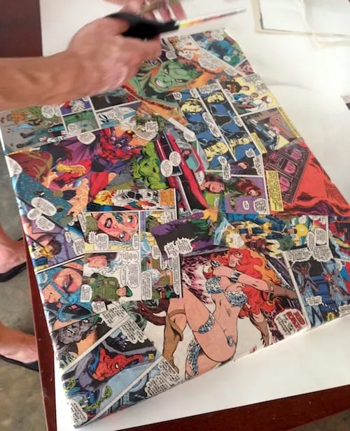 Canvas covered in comic book pages decoupaged down with Mod Podge