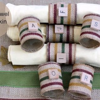 Use recycled paper towel rolls to make these burlap DIY napkin rings. You'd never guess they were made for pennies! Perfect for the holidays.