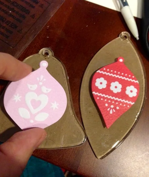 Placing stickers on top of the kraft paper ornament