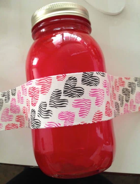 Wrapping Duck tape around the center of a Mod Podged mason jar
