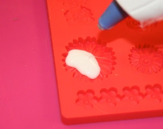 Filling a silicone mold with hot glue