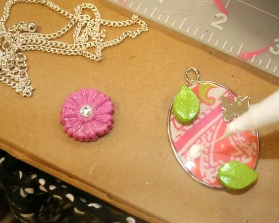 Glue embellishments to the DIY necklace