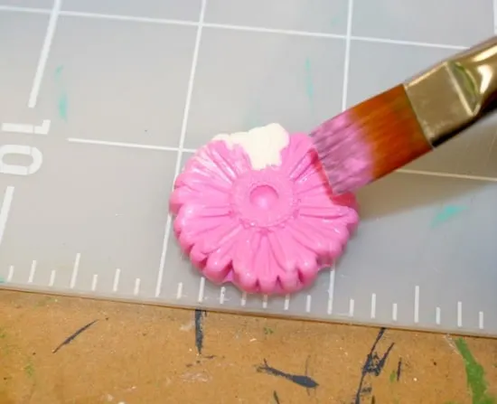 Painting a hot glue embellishment with pink acrylic paint