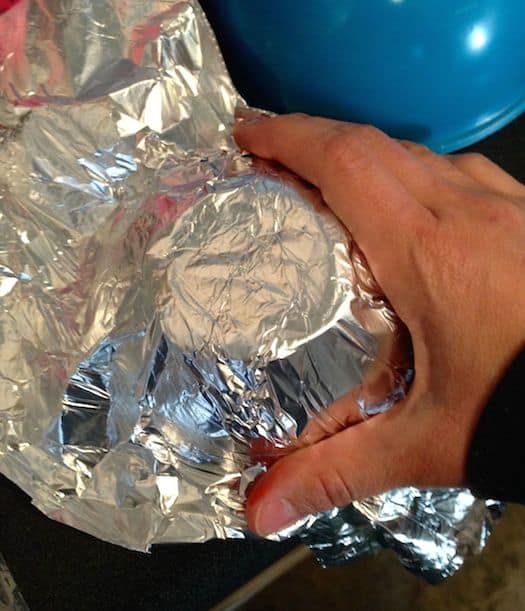 Covering a bowl with aluminum foil