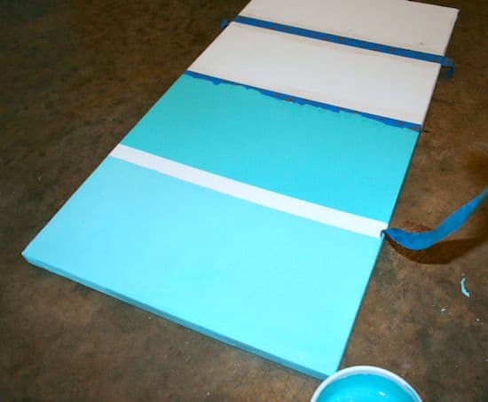Painting a canvas with aqua ombre stripes