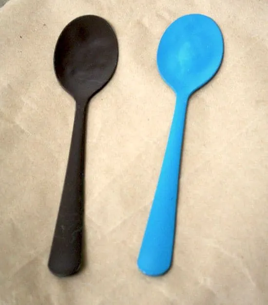 Spray painted spoons on butcher paper