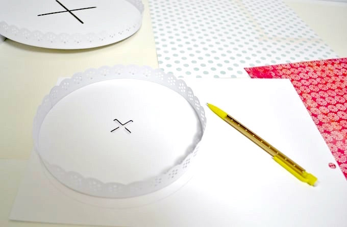 trace a cake stand on a piece of paper with a pencil