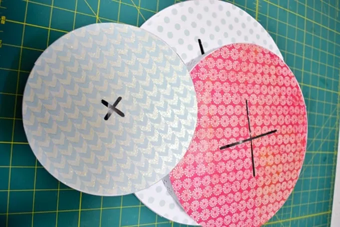 scrapbook paper on a cake stand