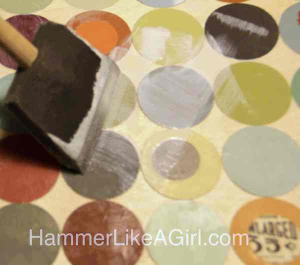 Mod Podging over the top of the paint chips with a foam brush