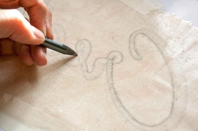 Tracing a word onto fabric in reverse using a pencil