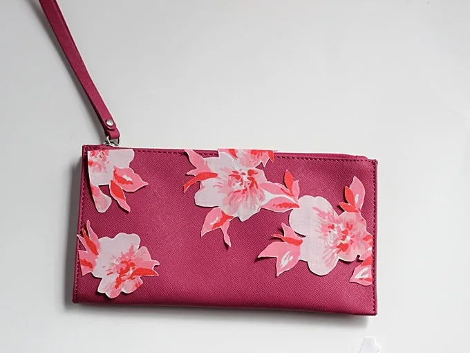 Clutch with unglued fabric flowers on the front