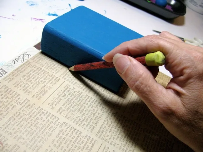 Tracing the blocks on scrapbook paper with a pencil