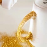 Close up of glitter in wet Dishwasher Safe Mod Podge on a mug handle