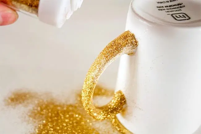 Close up of glitter in wet Dishwasher Safe Mod Podge on a mug handle