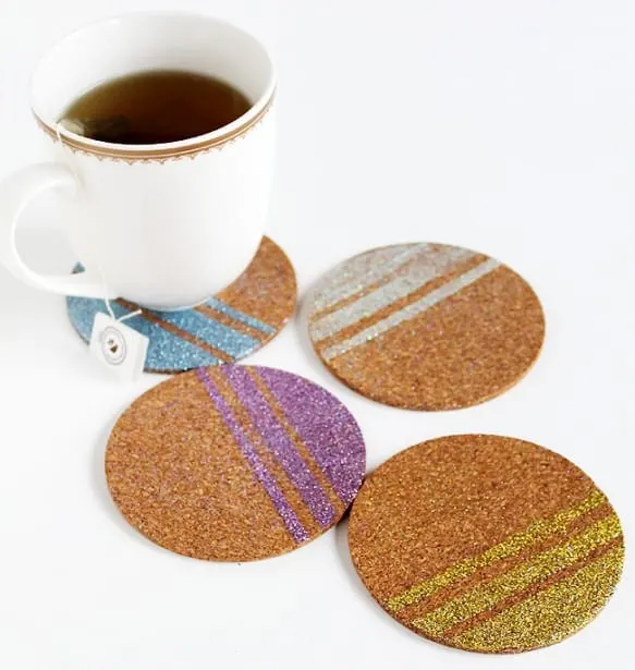 Make these decoupage glitter DIY coasters to help your guests or family members keep their drinks straight - no more guessing whose drink is whose.