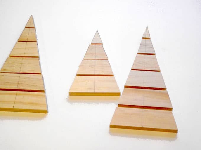 Wood slats cut into tree shapes for a Christmas centerpiece