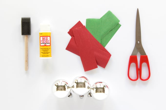 Foam brush, Mod Podge Matte, tissue paper, scissors, and silver Christmas ornaments