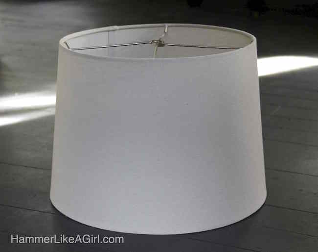 White lampshade sitting on a table