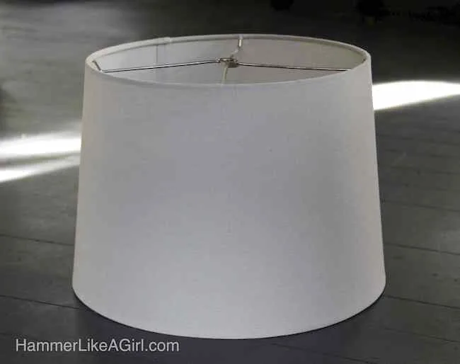 White lampshade sitting on a table
